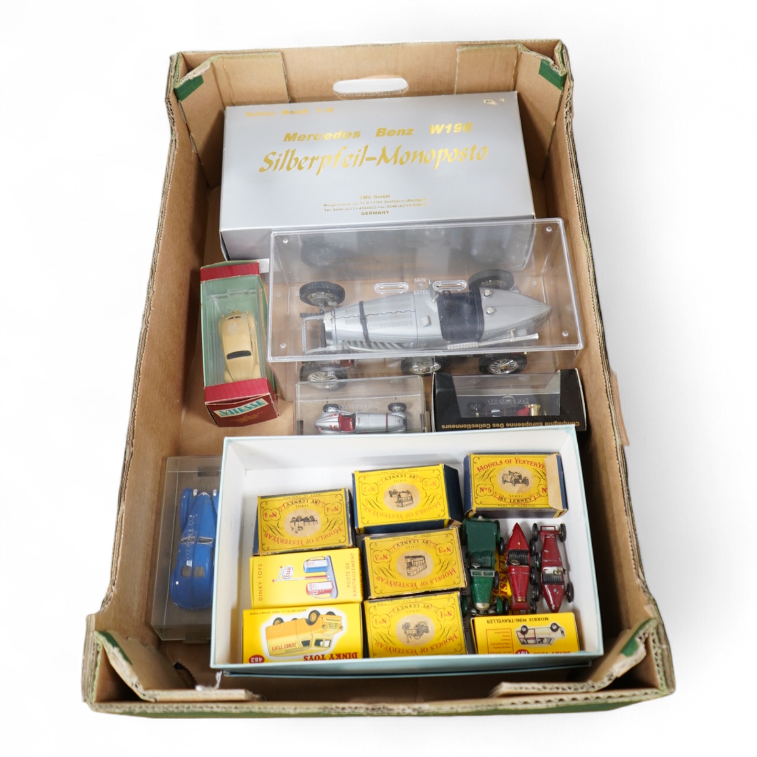 A collection of diecast vehicles, including a boxed CMC 1:18 scale Mercedes Benz W196 1950s single seat racing car, together with five boxed early Matchbox Models of Yesteryear, two Atlas Dinkies, a 1:18 scale Bburago Bu